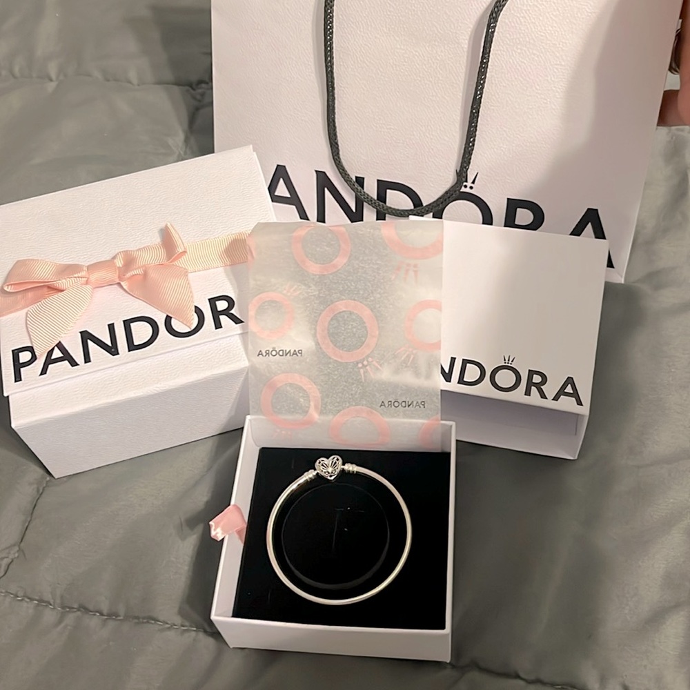 Brand New and NEVER used Small Pandora heart and butterfly bracelet.